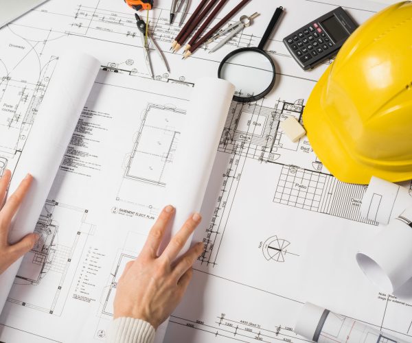 crop-architect-opening-blueprint